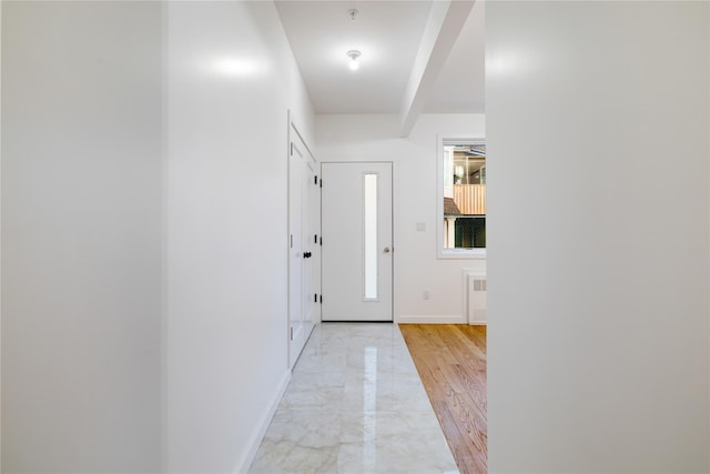 interior space with baseboards and marble finish floor