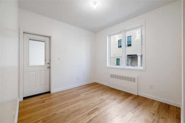 29 Calvert Dr Unit 114, Monsey, NY 10952 - spare room featuring radiator, baseboards, and light wood finished floors