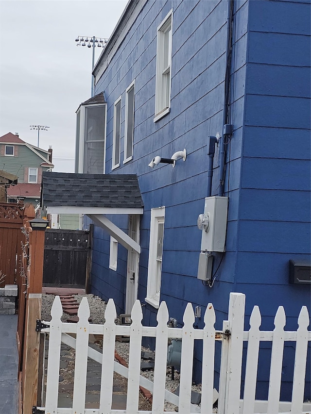 view of home's exterior featuring fence