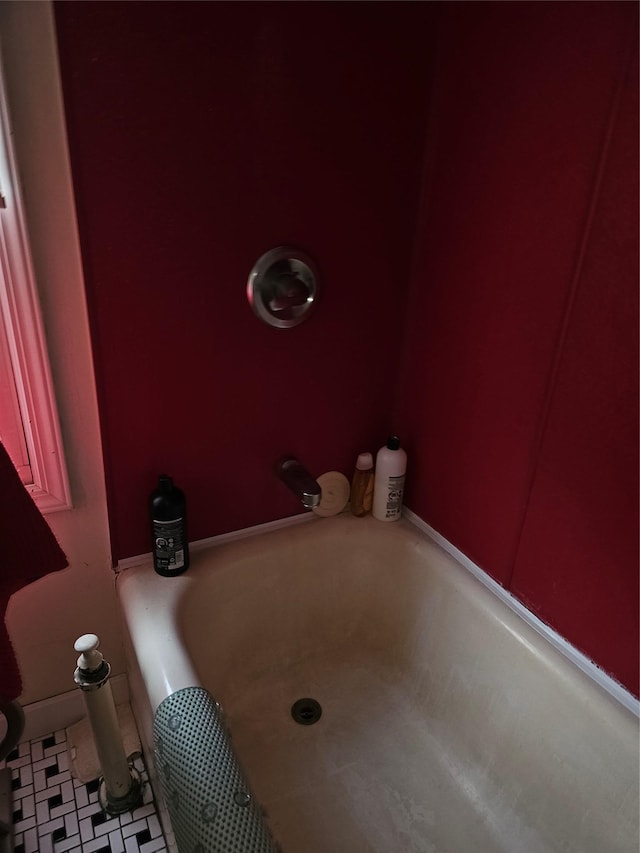 full bathroom with tile patterned floors and a bathing tub