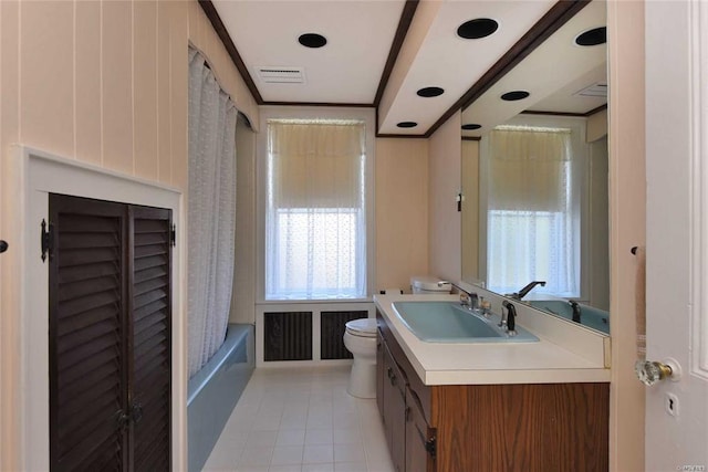 full bathroom featuring toilet, vanity, tile patterned floors, crown molding, and shower / bath combination with curtain