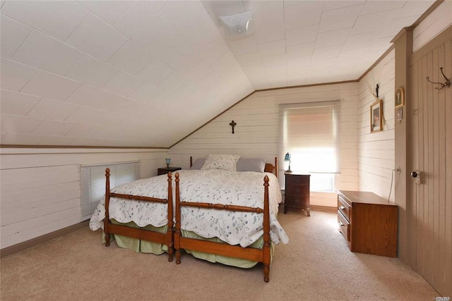 carpeted bedroom featuring lofted ceiling and wooden walls