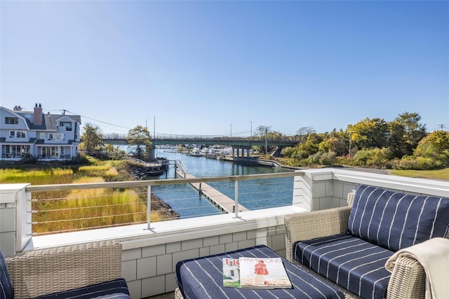 balcony featuring a water view