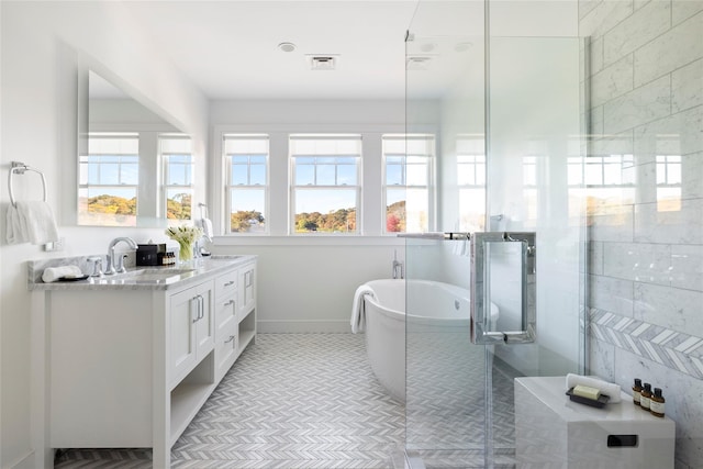 bathroom featuring a shower stall, visible vents, a freestanding bath, and vanity