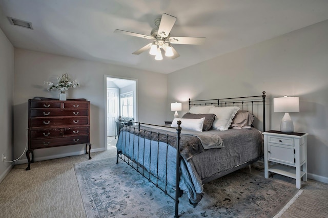 bedroom featuring carpet flooring, baseboards, visible vents, and a ceiling fan