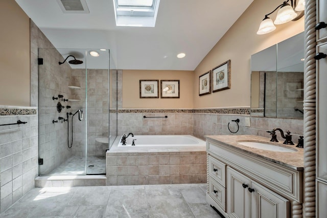 bathroom featuring visible vents, a stall shower, tile walls, a bath, and vanity