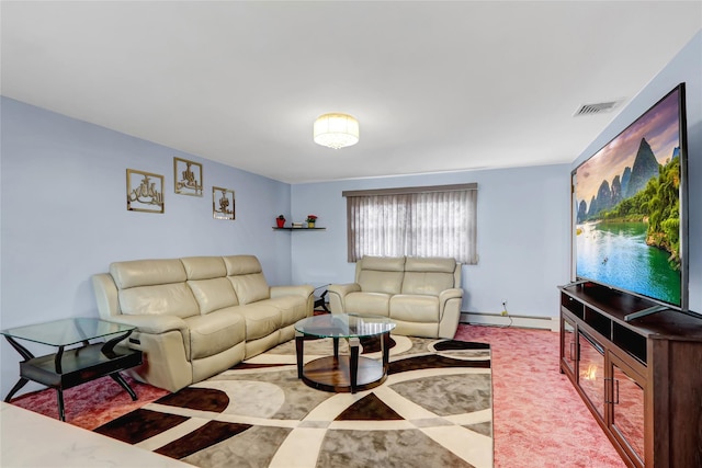 living area featuring visible vents, baseboards, and a baseboard radiator