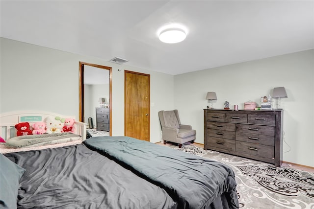 bedroom with visible vents and baseboards