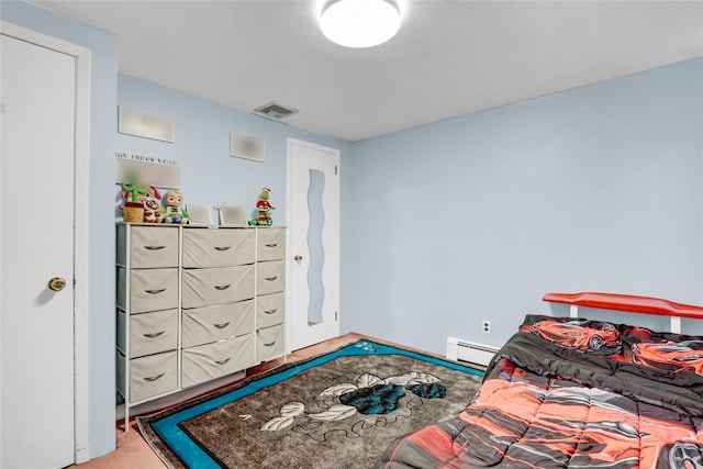 bedroom featuring baseboard heating, light colored carpet, and visible vents