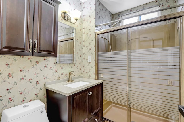 full bath with wallpapered walls, toilet, and a stall shower