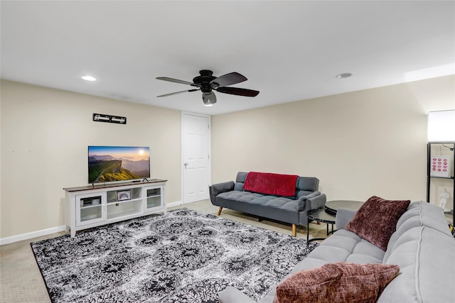 carpeted living room with recessed lighting, a ceiling fan, and baseboards