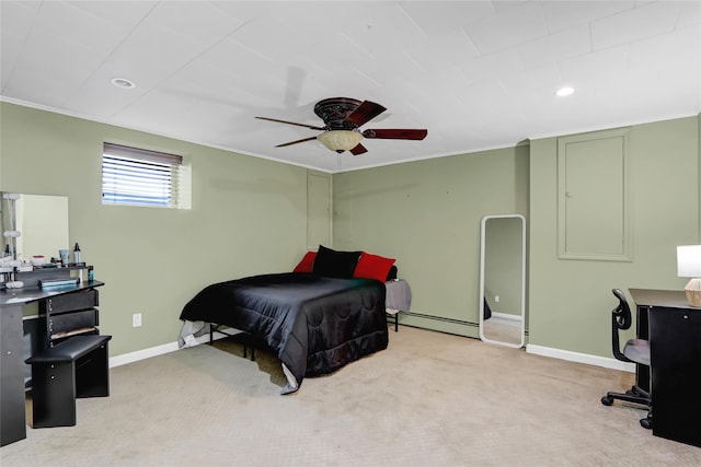 carpeted bedroom featuring ceiling fan, a baseboard heating unit, baseboards, and ornamental molding