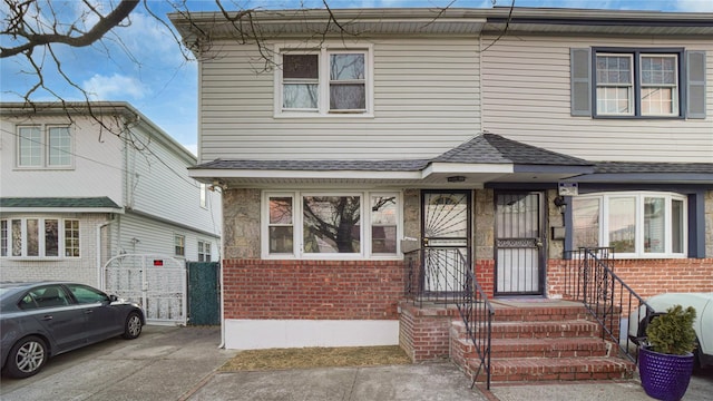 view of front of property featuring brick siding