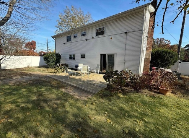 back of house with a patio area, fence, and a yard