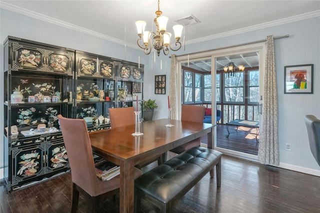 dining room featuring a notable chandelier, crown molding, and visible vents