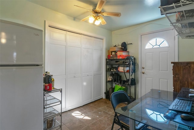 interior space featuring tile patterned flooring and ceiling fan