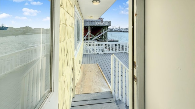 balcony featuring a water view