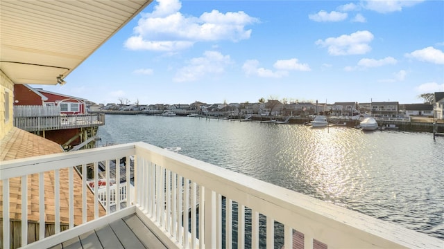 balcony featuring a water view