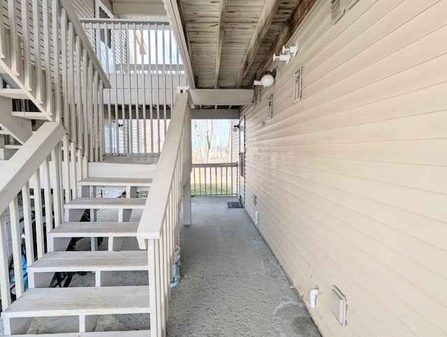 stairs with wood walls