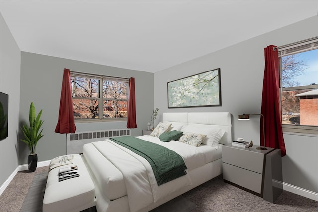 bedroom featuring radiator, carpet floors, and baseboards