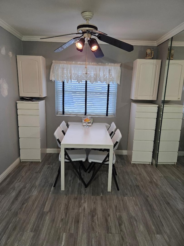 unfurnished dining area featuring baseboards, dark wood-style flooring, and crown molding