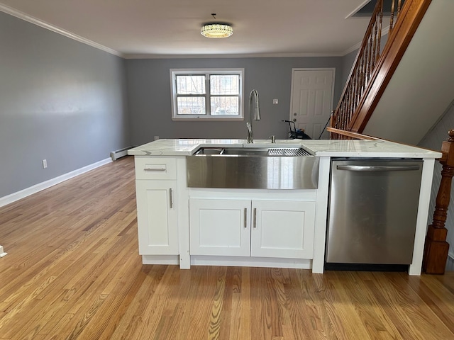 kitchen with a sink, light stone countertops, crown molding, and dishwasher