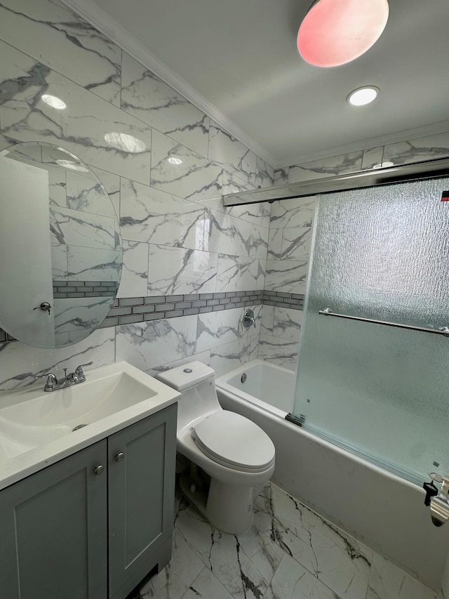 bathroom featuring toilet, bath / shower combo with glass door, vanity, marble finish floor, and crown molding