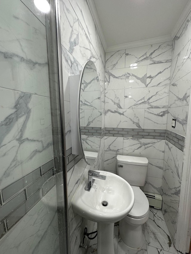 bathroom with marble finish floor, stone wall, toilet, and crown molding