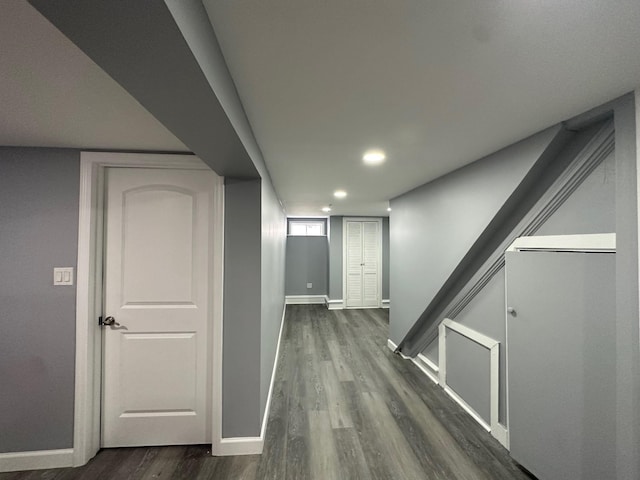 hallway with recessed lighting, dark wood finished floors, and baseboards