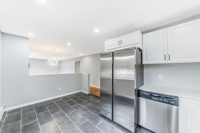 kitchen with recessed lighting, light countertops, appliances with stainless steel finishes, white cabinetry, and baseboards