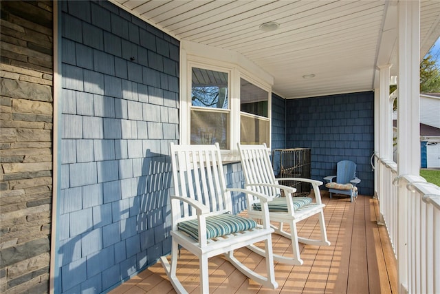 wooden terrace with a porch