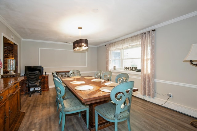 dining room featuring ornamental molding, a baseboard heating unit, and wood finished floors