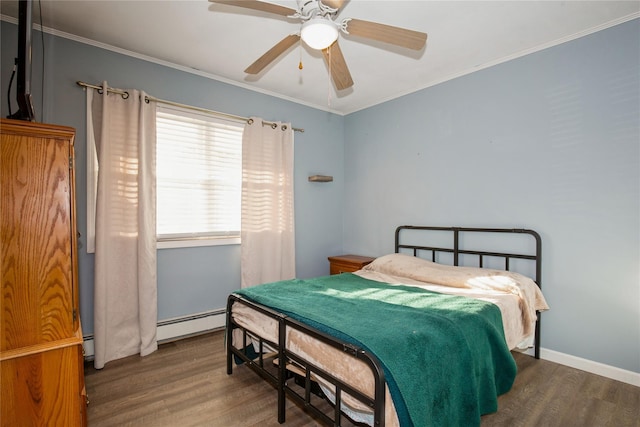 bedroom with a baseboard heating unit, crown molding, ceiling fan, and wood finished floors