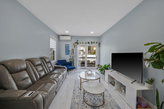 living area featuring recessed lighting, an AC wall unit, and marble finish floor