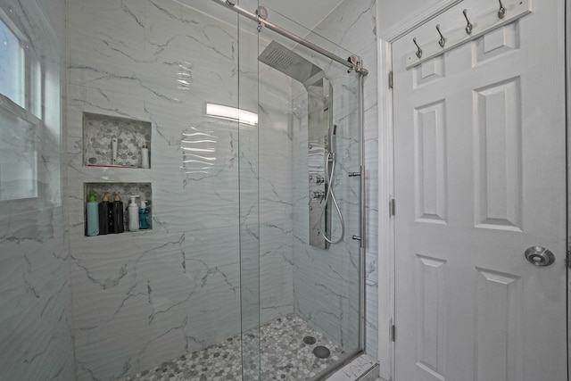 full bath with a marble finish shower