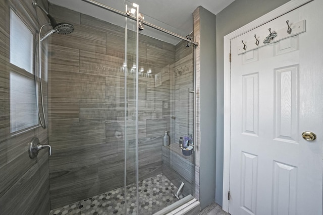 full bath featuring a shower stall