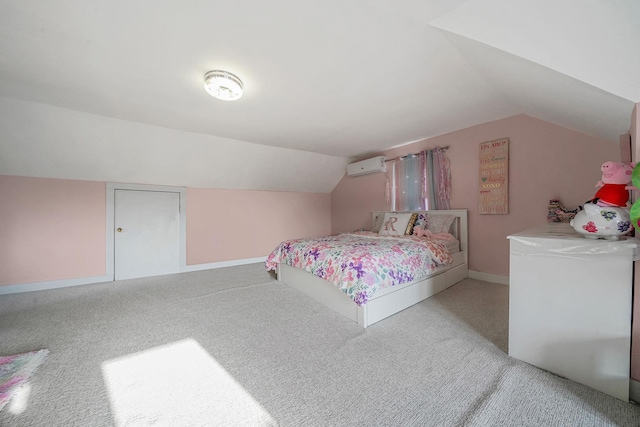 carpeted bedroom with baseboards, vaulted ceiling, and a wall mounted air conditioner