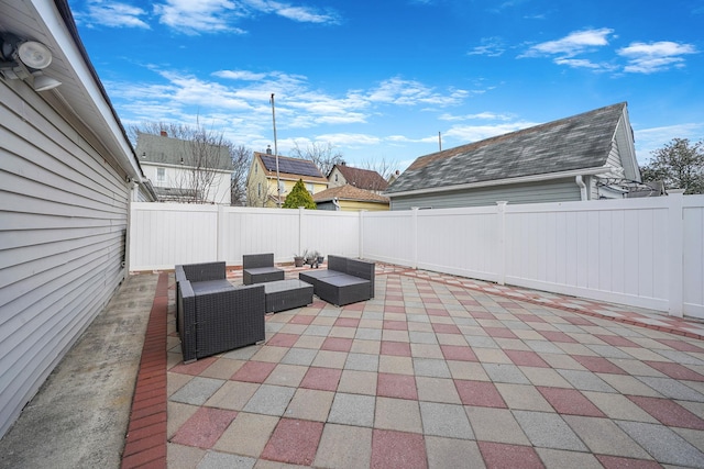 view of patio / terrace featuring a fenced backyard and an outdoor living space