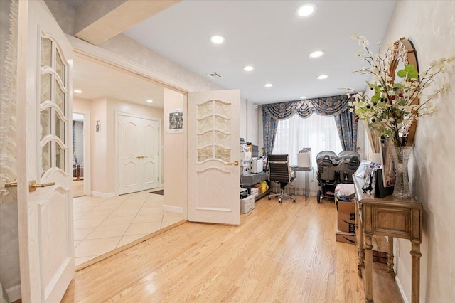 office space with baseboards, wood finished floors, visible vents, and recessed lighting