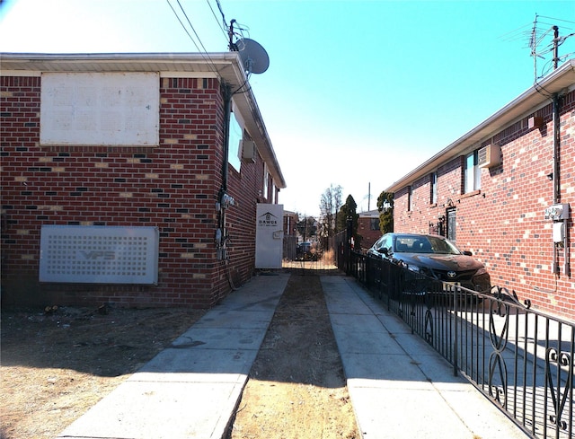 view of side of home featuring brick siding