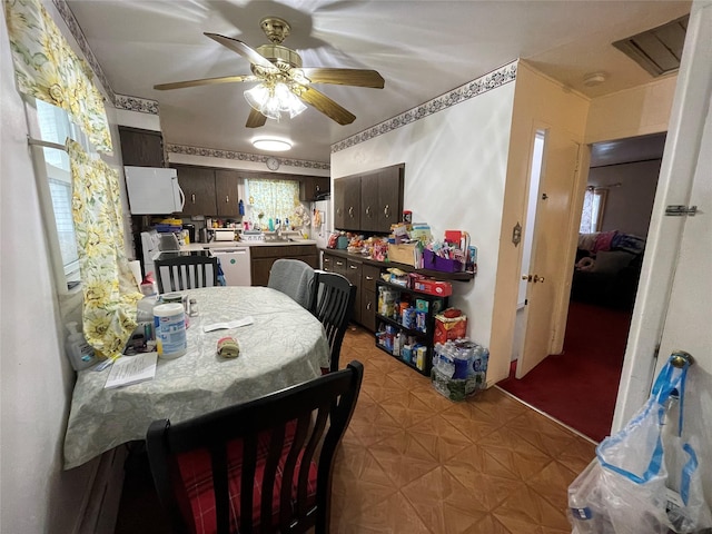 dining room featuring ceiling fan and light floors