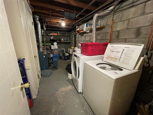 washroom with laundry area and washer and dryer