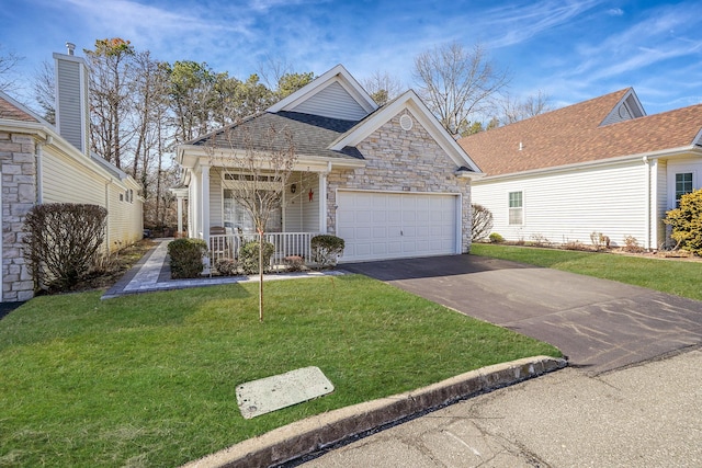 view of front facade featuring aphalt driveway, an attached garage, stone siding, roof with shingles, and a front lawn