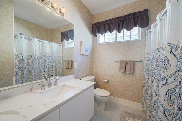 full bathroom with wallpapered walls, baseboards, toilet, tile patterned floors, and vanity