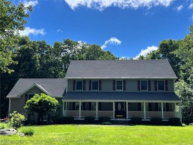 view of front of house featuring a porch and a front lawn