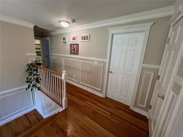 hallway featuring crown molding, an upstairs landing, and wood finished floors