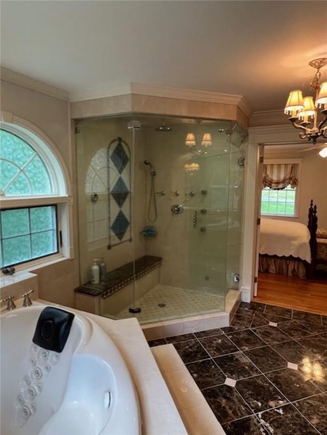 full bath featuring a stall shower, crown molding, an inviting chandelier, and ensuite bathroom