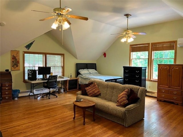 bedroom with a baseboard radiator, a wall unit AC, vaulted ceiling, and wood finished floors