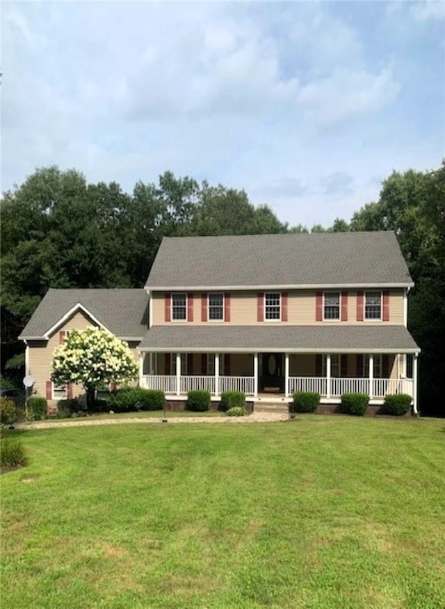 view of front of property featuring a front lawn and a porch