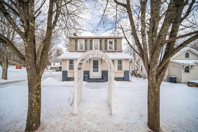 view of front of home with a chimney